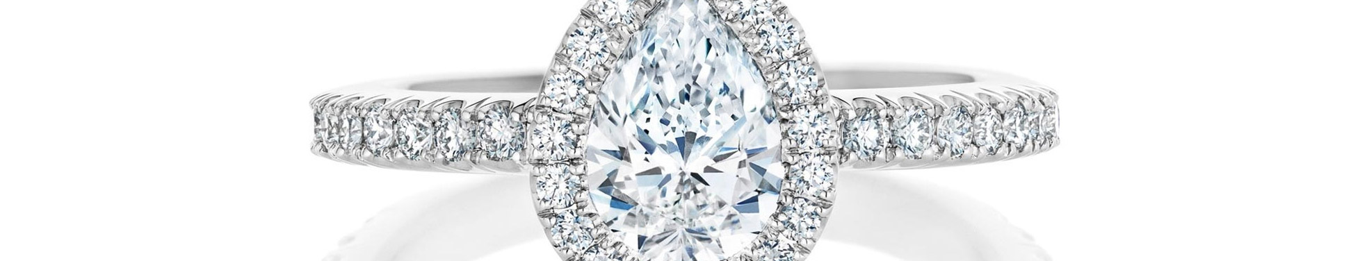 pear shaped diamond halo engagement ring.